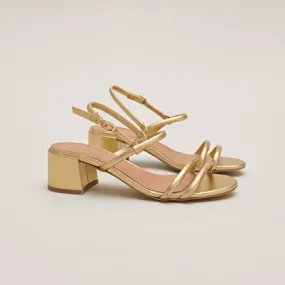 Heeled sandals in gold metallic leather