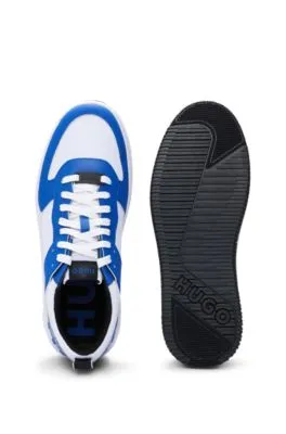 Mixed-material trainers with raised-logo backtab